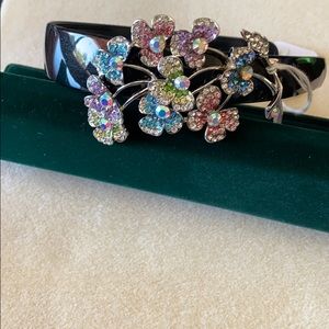 Head band with decorative floral spray